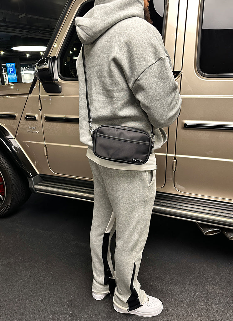 Umhängetasche mit Reißverschluss und Logo - Schwarz