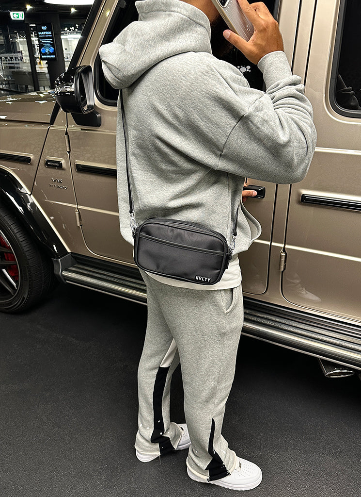 Umhängetasche mit Reißverschluss und Logo - Schwarz