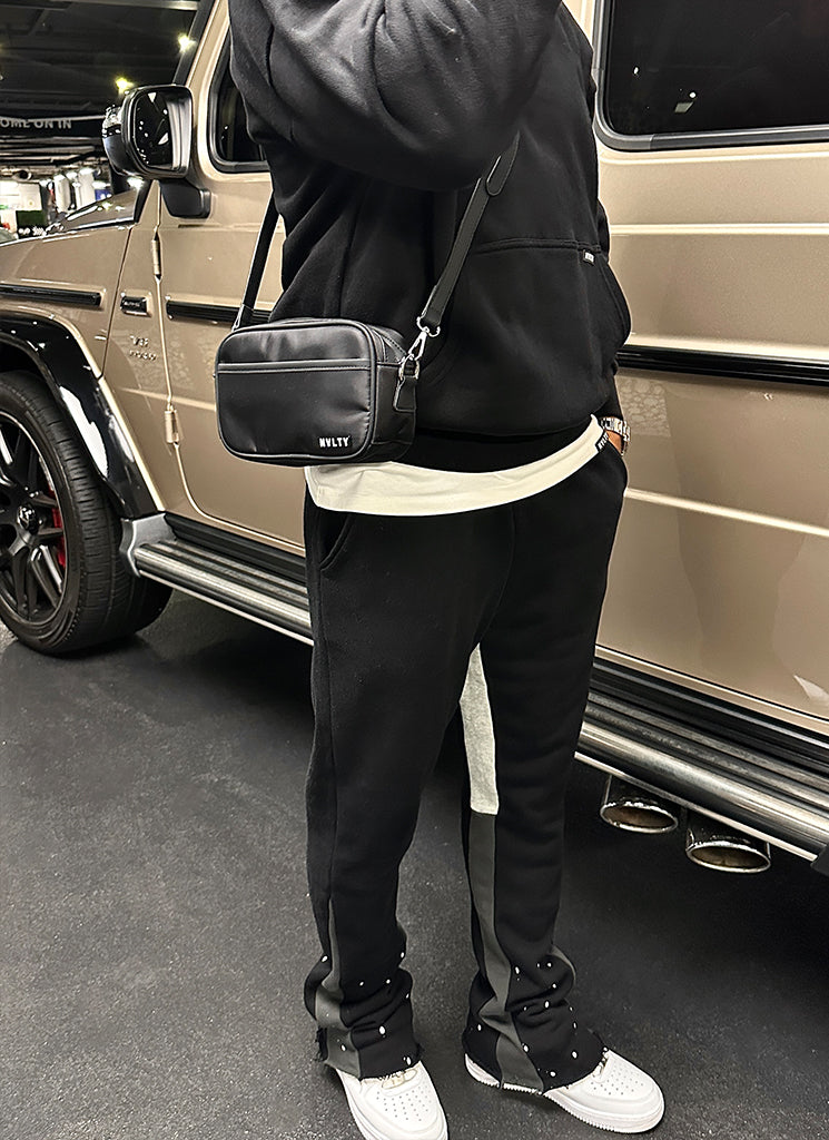 Umhängetasche mit Reißverschluss und Logo - Schwarz