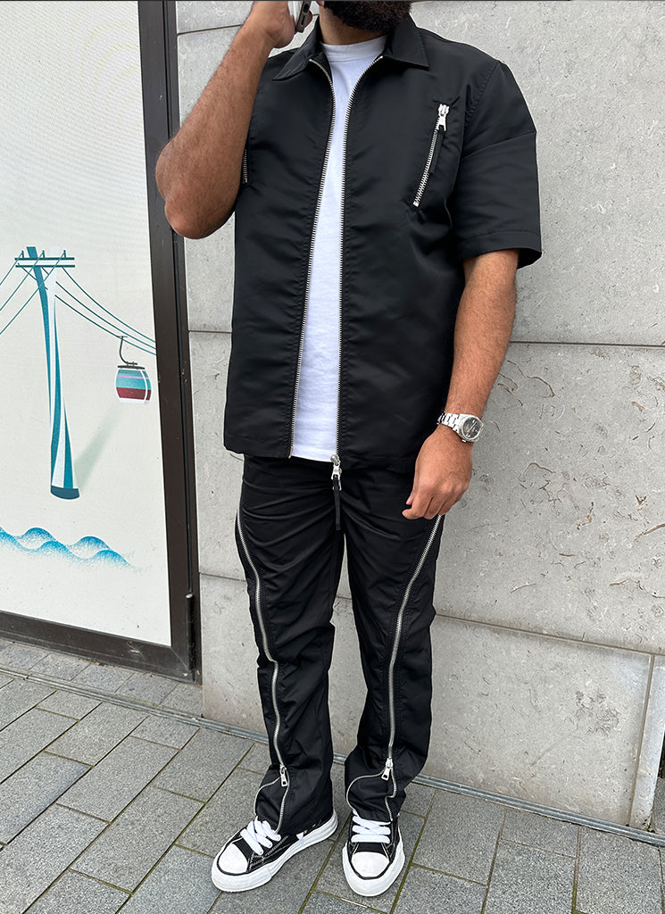 Schlaghose aus Nylon mit Reißverschluss - Schwarz