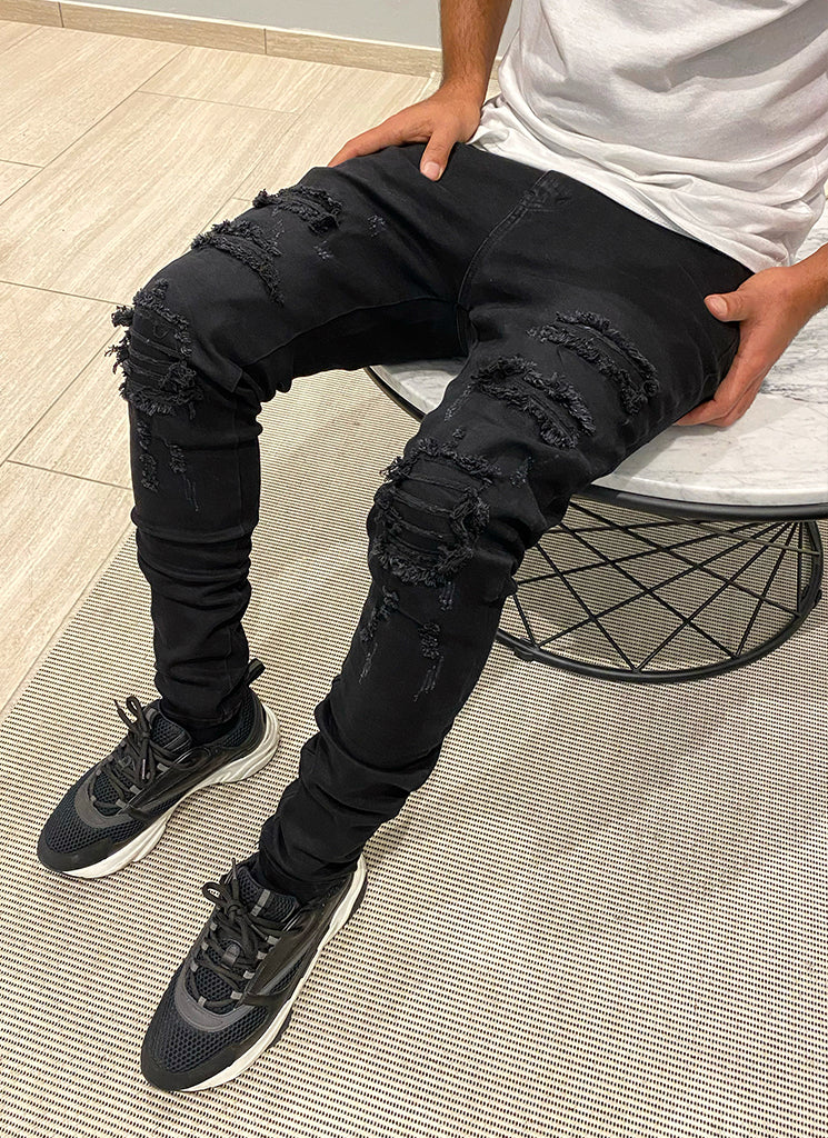 Zerrissene und reparierte Jeans – Schwarz
